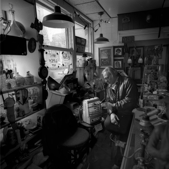 Portrait of Bill Stettner in his shop 'The Garage Sale', New York © Peter Adams 1991